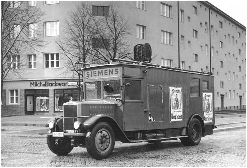 A truck of the fascist Nazi party drives through the Prenzlauer Promenade in Berlin - Pankow.